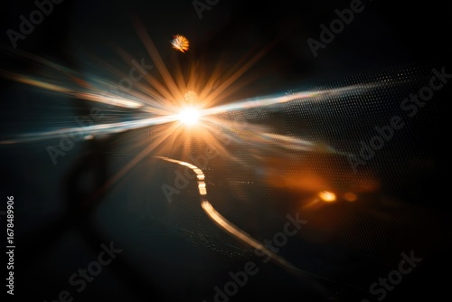 Abstract sunburst through a dark surface