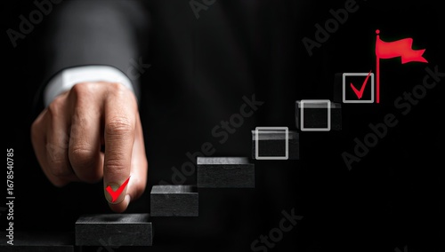 Business hand checks off step on a stairway to success