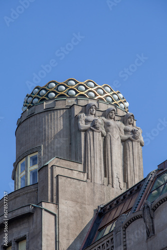 Top of Art Nouveau Koruna Palace, terminated by crown-shaped attribute expressing name of palace, Prague, Czech Republic