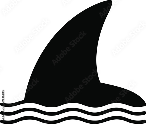 Sharp black shark fin emerges from rippling water surface ocean predator apex animal danger threat silhouette