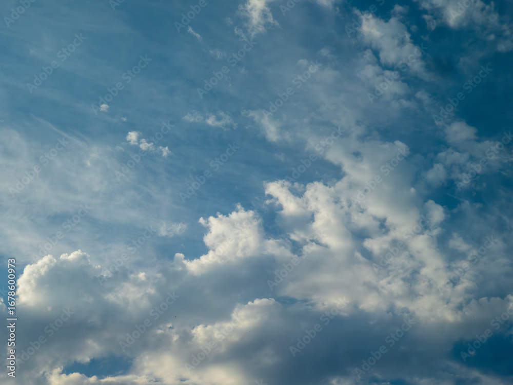 Fototapeta premium Dramatic Sky with Fluffy and Wispy Clouds.