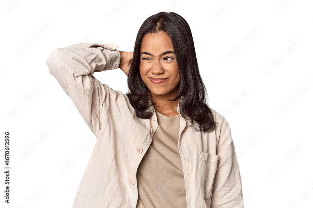 Portrait of a young Filipino woman touching back of head, thinking and making a choice. Portrait of a young Filipino woman touching back of head, thinking and making a choice.
