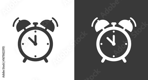 Classic twin bell alarm clock icon in black and white on contrasting backgrounds