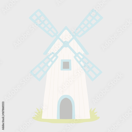 White wooden windmill rotating blades generating green energy in idyllic countryside