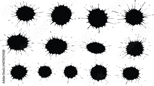 A collection of black ink splatters and blots on a white background, varying in size and shape, creating an abstract pattern.