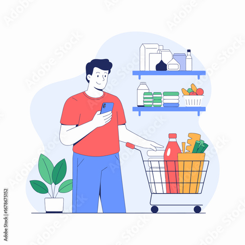 A man using his phone while shopping for groceries in a supermarket, with a cart full of items.