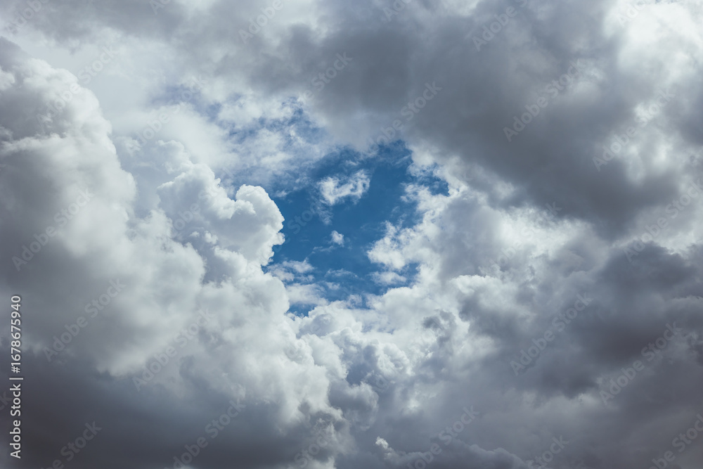 Fototapeta premium Cloudscape background. Sky view in the middle of dense clouds