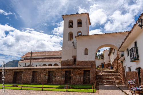 Colonial church in Chinchero, Peru, with white adobe bell tower