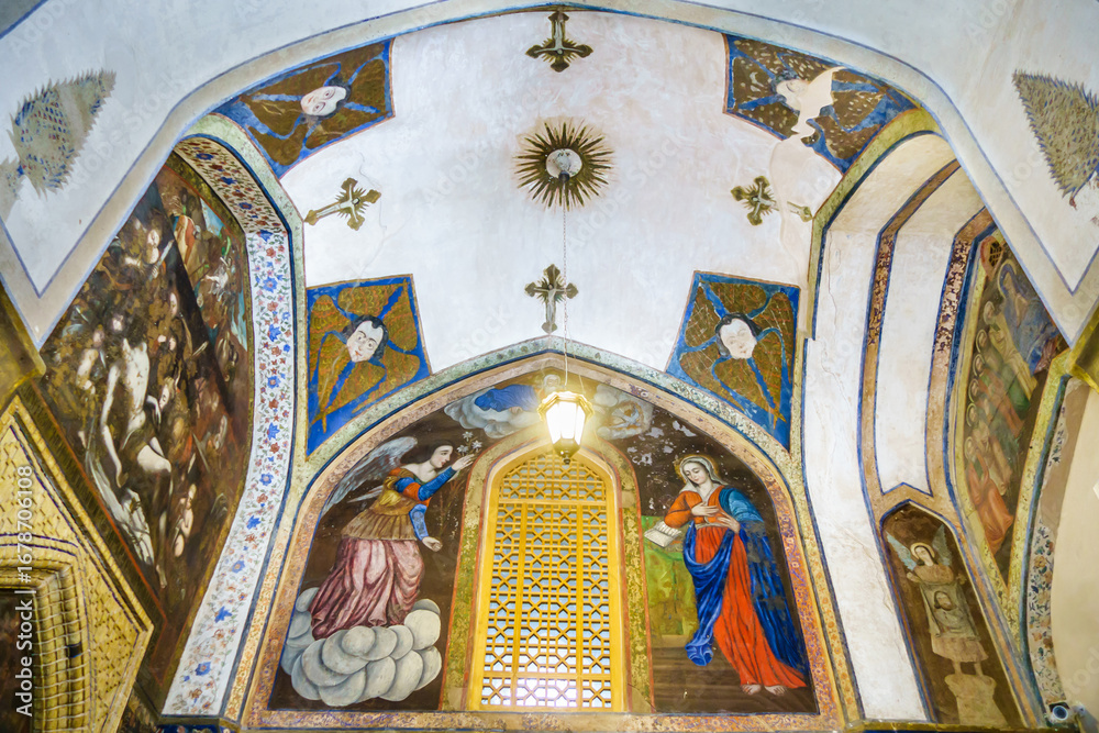 Obraz premium 17th century paintings above the entrance to Vank Cathedral in Isfahan, Iran. Visible are religious frescoes depicting the Annunciation, the Descent from the Cross, and various seraphim