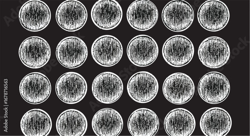 Abstract graphic design of circular patterns, textured and arranged in a grid.