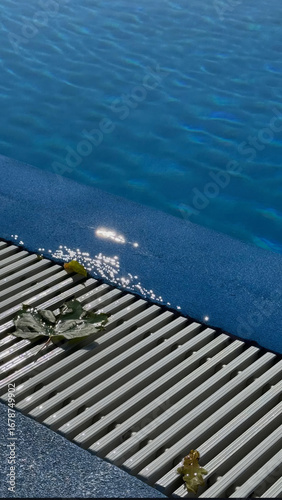 Glittering sunlit pool edge whispers serenity, aquatic tranquility for World Water Day and Midsummer's Day reflection rituals