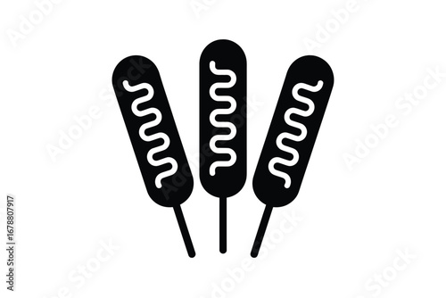 Three corn dogs with ketchup drizzle icon
