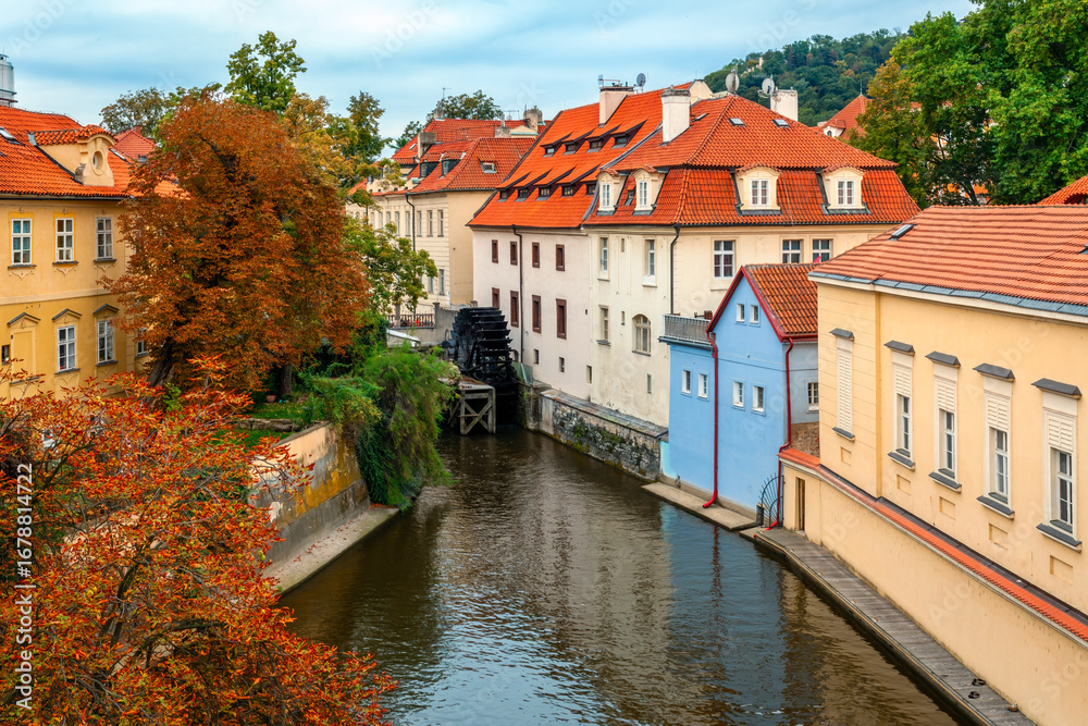 Fototapeta premium Narrow canal and colorful houses in Prague.