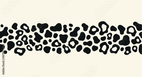 Modern black and ivory organic shapes create a stylish abstract pattern design
