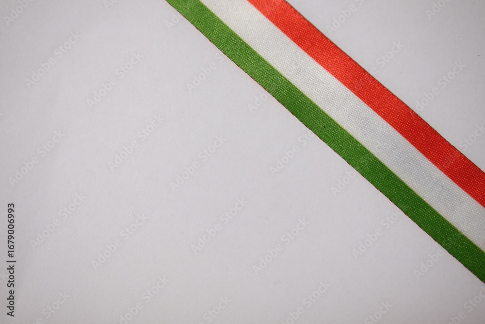Naklejka premium Diagonal Hungarian tricolor ribbon on white background, symbolizing national identity.