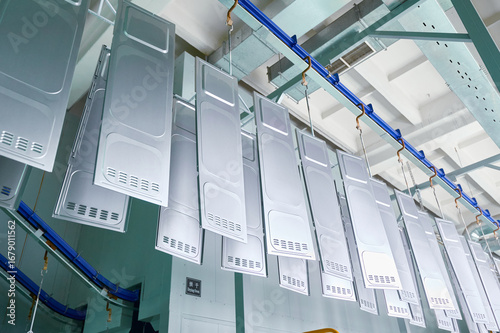 Metal parts undergo degreasing and rinsing process in a powder coating workshop