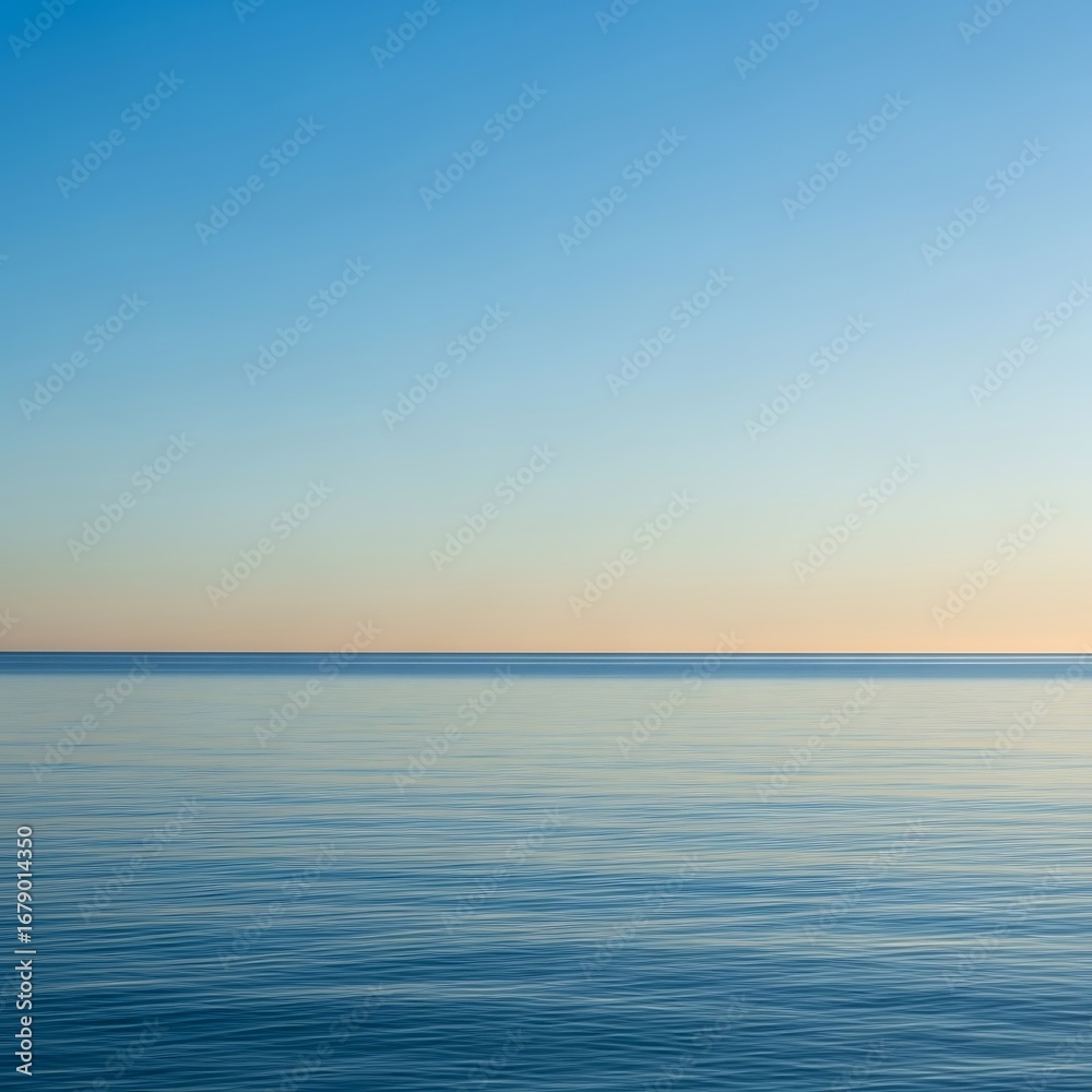 Naklejka premium Calm Horizon Over Still Water, Peaceful Blue Sky.