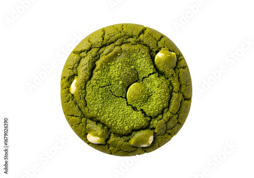 A round, vibrant green matcha cookie, speckled with white chocolate chips, is highlighted against a dark backdrop.