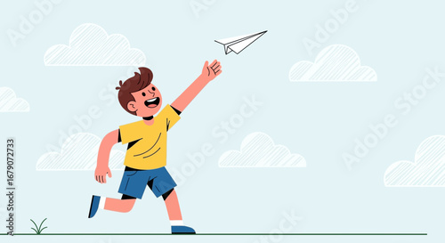 A cheerful boy joyfully launching a paper airplane into a clear blue sky and clouds