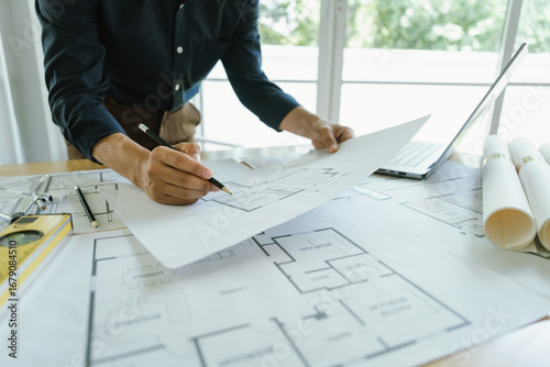 Fotografi Architectural concept, architect engineer freelance design work on initial project drawings, construction plans, architectural design, drafting blueprints and construction modeling