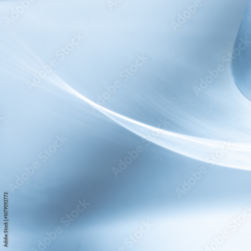 A blue and white abstract painting with a wave-like pattern