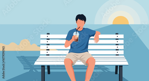 Young Man Sipping Iced Coffee While Relaxing On A Bench During Beautiful Sunset View