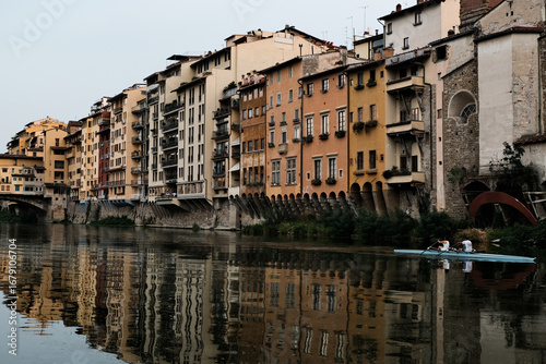 Reflective buildings on a river in Florence 