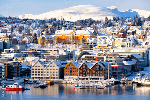Tromso harbor with houses, fjord, cruise ships and downtown on sunny winter day Norway travel