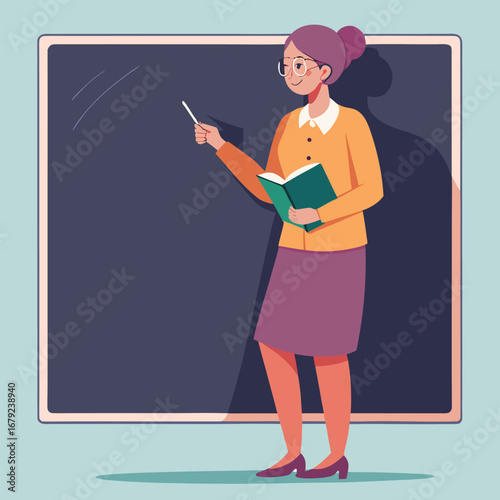 A happy woman teacher standing in a classroom holds a pointer and smiles while giving a presentation in front of a blank blackboard