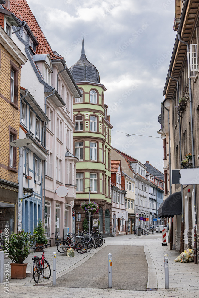 Obraz premium Historic German street with colorful old houses, bicycles and narrow cobblestone road