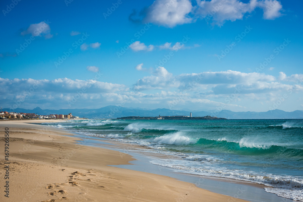 Fototapeta premium Ocean waves with swell on Los Lances beach in a eastern windy day, Tarifa, Cadiz Province, Andalusia, Spain