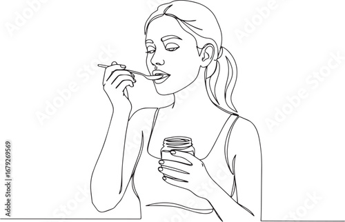Elegant woman enjoying a spoonful of honey, portrayed in minimal
