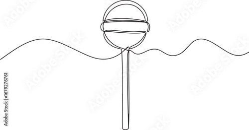 Minimalist continuous line art of a lollipop on a stick against