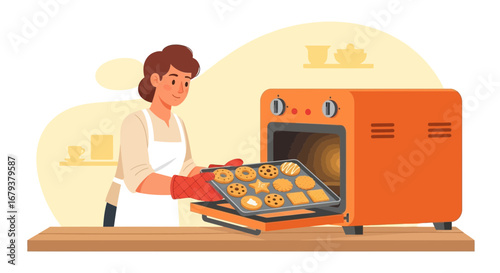 Woman Baking Cookies In Oven At Home For Family In Modern Kitchen