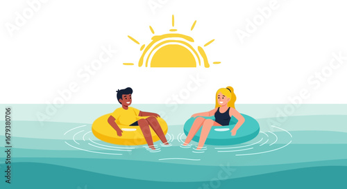 Two people floating on inflatable rings in the water on a sunny day