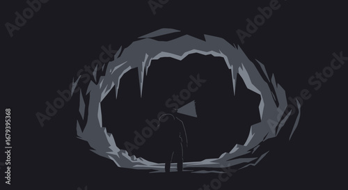 Silhouette of a Person Shining a Light in a Cave Exploring a Mysterious Place