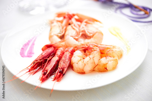  red prawns and Scampi on white plate, soft focus