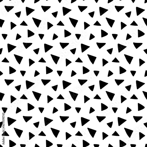 Abstract pattern of scattered black triangles with rounded edges on a white background