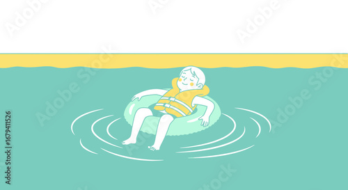 Relaxing child floats on an inflatable ring in the sea enjoying a summer day
