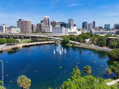View looking over Lake Lucerne and the downtown Orlando skyline with condo and business buildings in Orange County, Orlando, Florida, USA. 