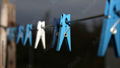 Colorful clothespins on a clothesline