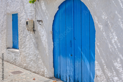 Paved alleys, traditional Cretan architecture, and preserved stone walls lead through the village of Gavalochori, Chania, Crete, Greece.