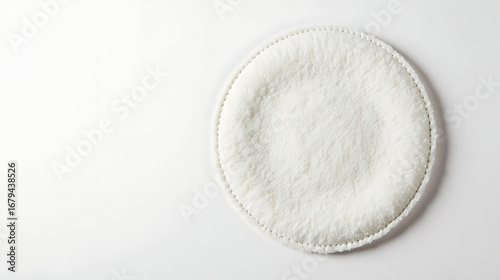 White round cotton pad with stitched edge, isolated on white 
