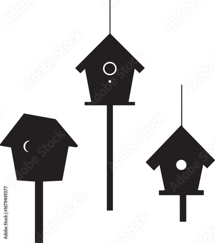 Three black birdhouse silhouettes on white background isolated isolated on white background