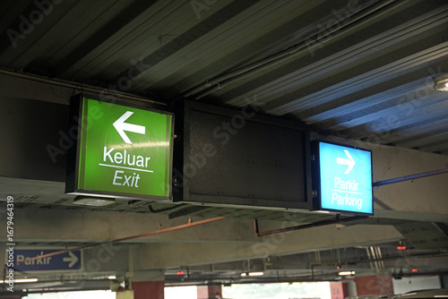 Exit sign and also parking sign in Car Parking area on the ceiling.