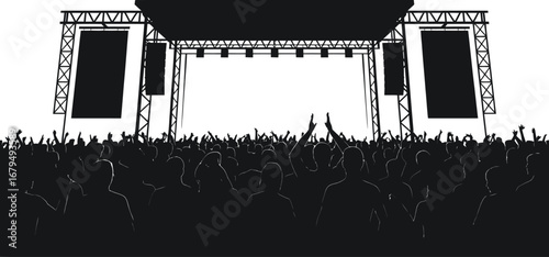Silhouette of a large outdoor concert stage with a cheering crowd