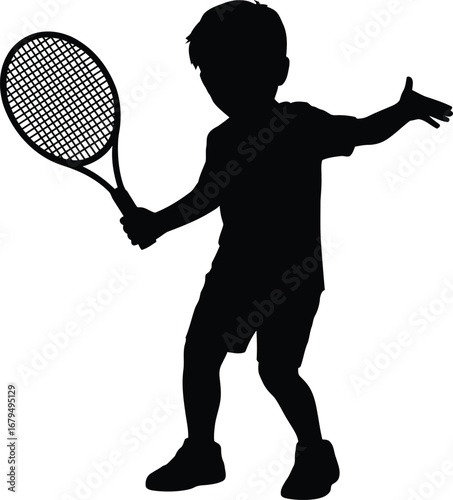 Silhouette of a young boy playing tennis with a racket