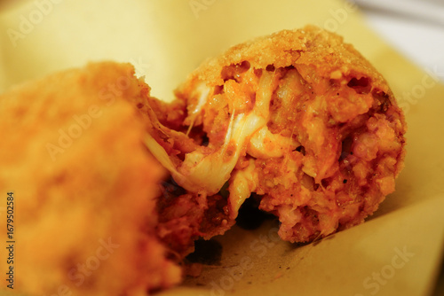 Canvas Print Supplì, a traditional Roman street food, rice croquettes filled with mozzarella