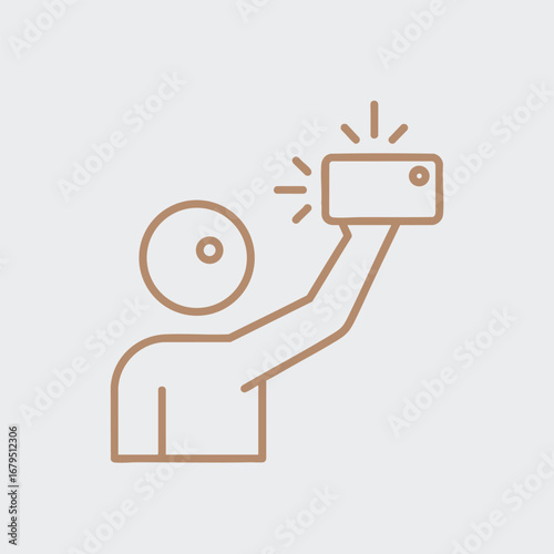 Person taking a selfie with a smartphone, showcasing a casual moment in a minimalist setting with soft lighting