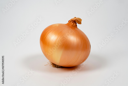 Wallpaper Mural A single golden brown onion with a dried stem isolated on white background Torontodigital.ca